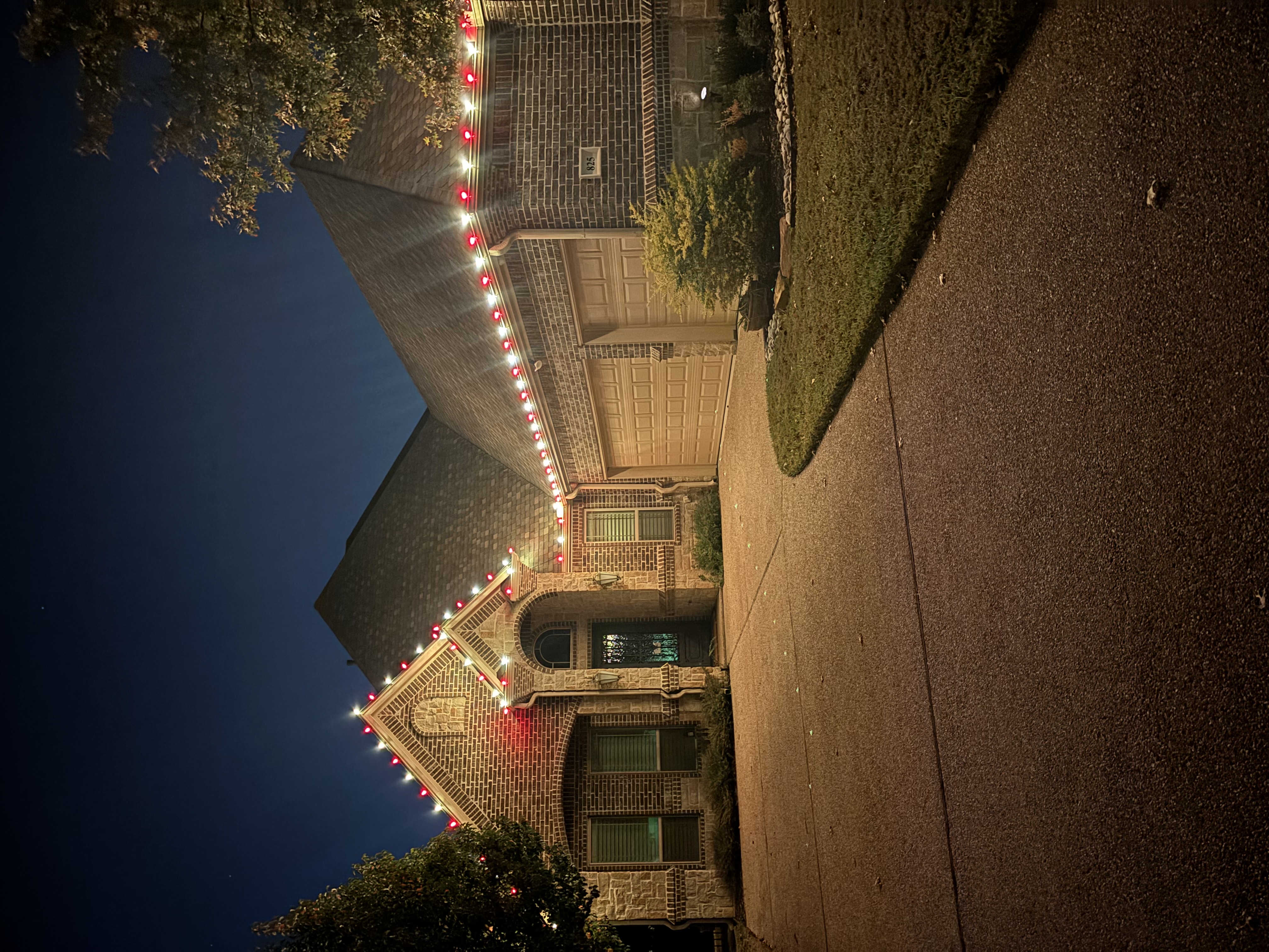 Holiday light installation on residential home
