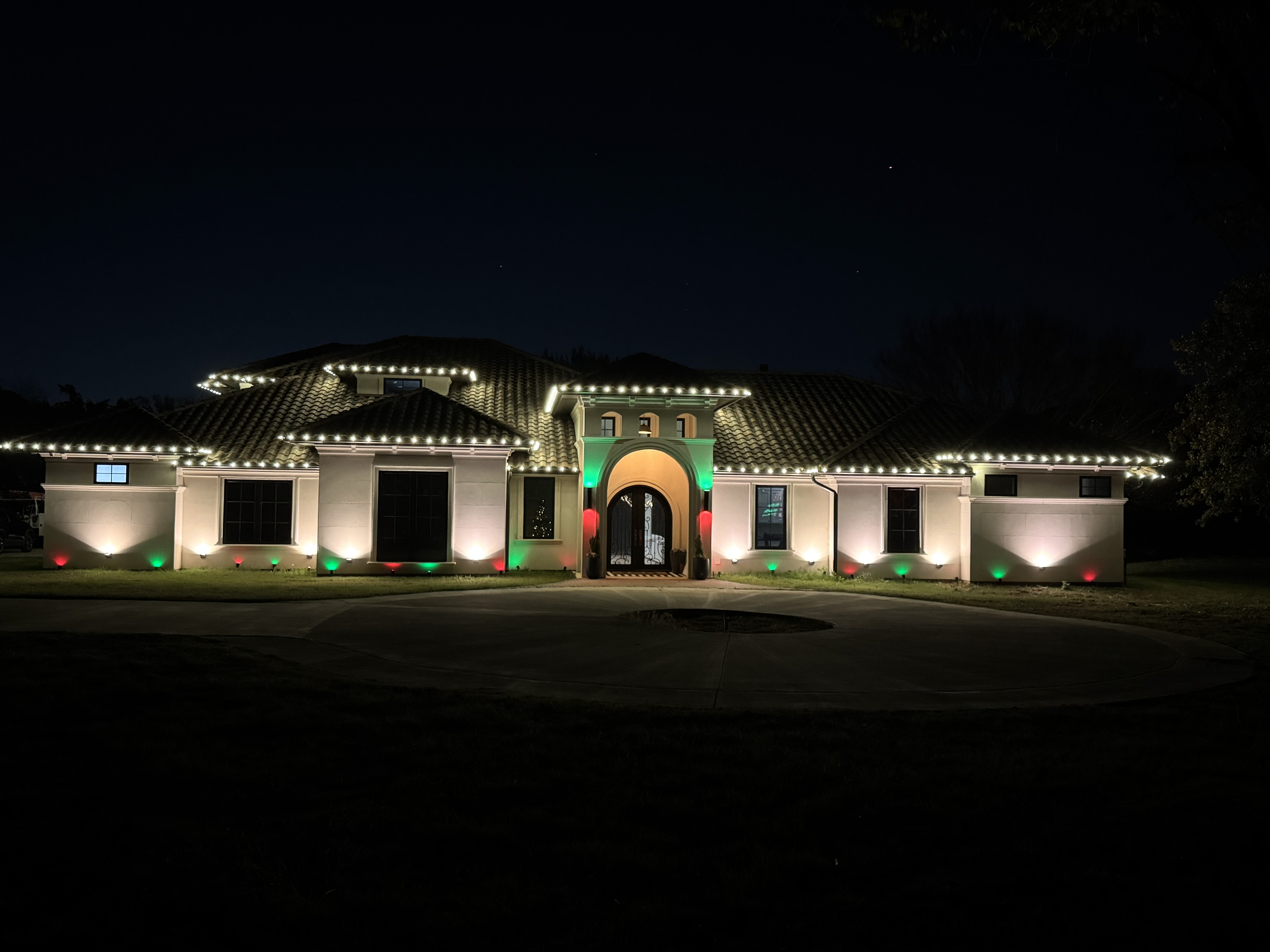 Holiday lighting installation on large home